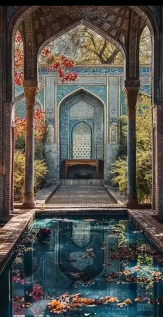 an ornate building with a pool in the middle