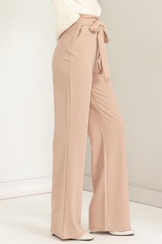 Look no further for a sizzling new look – our "Chic Flair" Cinched Tie Flared Pants are your answer to elevated style. With a high-rise silhouette and a cinched tie waist, these pants boast a fusion of fashion and function that embraces your curves in a flattering, hip-hugging fit. The flared-cut legs add a timeless trendy touch that remains in vogue throughout the seasons, making these pants a versatile addition to your fashion repertoire. Designed for casual elegance, the solid print and tie f Chic High-waisted Tie Waist Pants, Cotton High-waisted Wide Leg Pants With Tie Waist, White High-waisted Pants With Tie Waist, White Tie Waist High-waisted Pants, Elegant Black High-waisted Flare Pants, Romper And Jacket, High Waisted Flares, New Pant, Kimono Dress