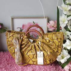 Nwt. Comes With Its Original Packaging And A Dust Bag. Urban Expressions 100% Vegan Leather. Yellow Brown Snakeskin Or Python Print. 2way Bag, With Adjustable Strap Included- Drop 17.5"-23". Approx.15.5"L X 3.5"W X 9.25"H Halfmoon Shape. Sold Out Item. Send Me Offer Ask For Any Questions. ** Please Bid Responsibly. Per Poshmark Policy, All Bids Are Binding, Meaning All Sales Are Final** Python Print, Animal Prints, Yellow And Brown, Python, Feathers, Binding, Vegan Leather, Bones, Animal Print