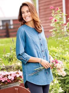 When going casual, you can't beat the soft, carefree look and feel of cotton denim. That's where this easy, up-for-anything denim tunic comes in. It falls loosely about you for all-day comfort while the gently gathered bib yoke in front and shoulder yoke in back provide plenty of style and interest. In fact, this tunic is so roomy, it could double as a lightweight jacket. Full button front Adjustable button cuffs Curved, side-slit hem Side pouch pockets Approx. 31" long 100% cotton denim Machine wash and dry Imported | Denim Tunic Top With Pockets - Blue Denim - Large - The Vermont Country Store Vermont Country Store, Denim Tunic, Gauze Top, Ruffled Tunic, Country Store, Floral Tunic, Jean Top, Comfortable Tops, Denim Top