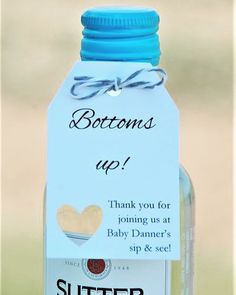 a bottle with a tag on it that says, bottoms up thank you for joining us at baby dancer's sip & see