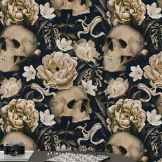 a skull with flowers in the background