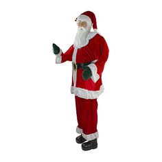 a man dressed as santa claus is standing in front of a white background and pointing at something