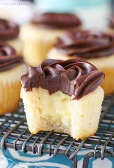 cupcakes with chocolate frosting on a cooling rack