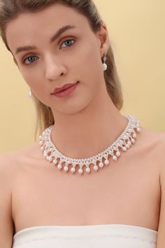 Embrace the opulence of our Vintage Triple-Layer Handcrafted Pearl Necklace, ideal for banquets and weddings. This exquisite piece features three sizes of near-round and oval-shaped pearls, meticulously handcrafted into a luxurious three-layer design. The necklace measures 40cm with an additional 5cm extension, offering flexibility and a perfect fit for any formal attire. Product Details: Pearl Types: Various Sizes, Near-Round and Oval Shapes Craftsmanship: Pure Handcrafted Style: Vintage Luxury Luxury Beaded Pearl Necklace For Evening, Luxury Pearl Jewelry For Party, Graceful Pearl Jewelry For Party, Evening Pearl Jewelry With Pearl Charm, Luxury Pearl Pendant Necklace For Party, Luxury Beaded Pearl Necklace For Parties, Evening Pearl Charm Jewelry, Pearl Drop Necklace For Evening, Pearl White Akoya Pearl Jewelry For Parties