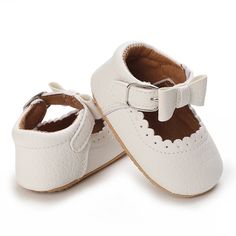 First walker shoes made specifically for developing feet. Soft sole. First Birthday Closed Toe Non-slip Booties, White Non-slip Flat Walking Shoes, White Non-slip Booties With Round Toe, White Booties With Rubber Sole For Playtime, White Synthetic Closed Toe Booties, White Slip-on Booties For Playtime, Synthetic Booties With Rubber Sole And Round Toe, White Closed Toe Walking Shoes, White Closed Toe Moccasins With Rubber Sole