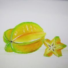 a drawing of some kind of fruit on a white paper with one cut in half