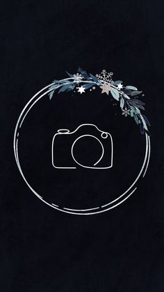 a camera and some flowers on a black background