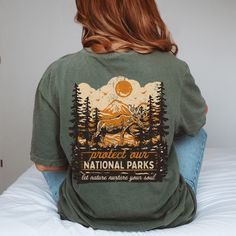 ✺ PROTECT OUR NATIONAL PARKS - GRANOLA GIRL GRAPHIC SHIRT  ✺ Get this trendy Comfort Colors graphic tee. * Q U I C K F A C T S * This design is a unique, one-of-a-kind awesome illustration that has been created in house. ✺ 100% ring-spun cotton ✺ Medium fabric ✺ Relaxed fit Please note that colours may appear different on different digital screens and may not be a true representation of the actual colours. This is a Unisex T-Shirt which you can use as an Oversize T-Shirt Dress, please check the Cheap Graphic Print Tops For Hiking, Affordable Casual T-shirt For Camping, Country Living Tshirt, Be Kind To Earth Shirt, Nature Shirts Tees, Earth Day Shirt, Granola Girl Aesthetic, Thrift Store Outfits, National Park Shirt