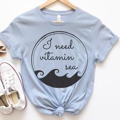 I Need Vitamin Sea is the perfect beach vacation shirt. This beachy t-shirt is everything you've dreamed of and more. It feels soft and lightweight, with the right amount of stretch. It's comfortable and flattering for all.  Show off your personality with our fun and unique designs!   ** P R O D U C T   D E T A I L S **  - High Quality, Super Soft and Comfy Bella + Canvas T-Shirt  - 100 % Pre-Shrunk Cotton  (heather colors are polycotton blend)  - Direct to Garment print (no stencils or vinyl wh Funny Print T-shirt For Beach Vacation, Vsco Style Beach Tops For Vacation, Funny Print Beach Shirt For Spring, Spring Beach Shirt With Funny Print, Trendy Beach Vacation Shirt, Beachy Shirt For Beach Party, Summer Shirt For Beach Party, Beachy Vacation Shirt, Summer Vacation Shirt For Beach Season