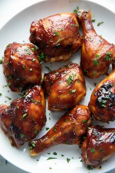 chicken wings with herbs on a plate ready to be cooked in the oven for dinner