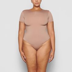 A versatile t-shirt bodysuit that offers light level of compression and smoothing. This style is made to wear alone or under clothing as the perfect base layer. Under Clothing, Shirt Bodysuit, Versatile Wardrobe, Tigers Eye, Natural Shapes, Base Layer, Kim Kardashian, Tigers, Foundation