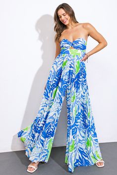 A printed woven jumpsuit featuring sweetheart neckline, center cut out, pleated pant and smocked back bodiceDetails:Self : 100% PolyesterLining : 100% PolyesterSize & Fit- Model is 5`9" And Wearing Size Small- Measurements Taken From Size Small- Approx. Length: 52" Blue Wide-leg Jumpsuits And Rompers For Day Out, Wide Leg Blue Jumpsuit For Day Out, Blue Strapless Wide Leg Jumpsuit For Summer, Blue Sleeveless Jumpsuit With Smocked Back, Sleeveless Blue Jumpsuit With Smocked Back, Blue Jumpsuits And Rompers With Smocked Back For Beach, Blue Jumpsuit With Smocked Back, Blue Strapless Jumpsuit For Spring Vacation, Blue Strapless Jumpsuit For Spring Day Out