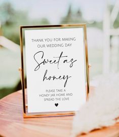 a sign that says thank you for making our wedding day sweet as honey