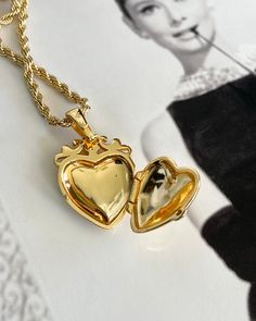 This Love Token Locket Necklace is the perfect piece for anyone looking to add a touch of elegance and romance to their wardrobe. Crafted from high-quality gold plating, it serves as a beautiful symbol of love and affection. Wear it close to your heart as a reminder of the special bond you share with your loved one. Gold Plated Silver functioning heart locket measuring 25mm x 20mm x 6.7mm. Gold plated Brass Rope chain 2.5mm thick and 16-18 inches in length. Elegant Heart Locket Necklace With Adjustable Chain, Elegant Heart Pendant Locket Necklace With Adjustable Chain, Elegant Rose Gold Heart Locket Necklace, Elegant Heart Charm Locket Necklace, Wedding Heart Pendant Gold Plated Locket Necklace, Elegant Heart Shaped Locket Necklace, Gold-tone Heart Pendant Necklace, Elegant Locket Necklace With Heart Charm Pendant, Gold Plated Heart Locket Pendant Necklace