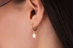 Our star charm earring is 14k solid gold and it has a star charm that dangles on it. It's an earring that looks beautiful on your all outfit. Thanks to its closure, our gold star hoop earring is comfortable enough to wear every day. If you are searching for a gift for your loved ones, this dangle star earring will be a perfect choice. It makes happy your loved ones on mother's day, birthdays, valentine's day, anniversaries, Christmas, or graduations. The gold star hoop earring's inner diameter i Star-shaped Hoop Earrings With Dangling Charms For Gift, Star-shaped Hoop Earrings With Dangling Charms, Star Shaped Hoop Earrings With Dangling Charms For Gift, Earring Star, Star Earring, Earring Dangle, Earring Gift, Gift For Her Birthday, Gold Heart Necklace