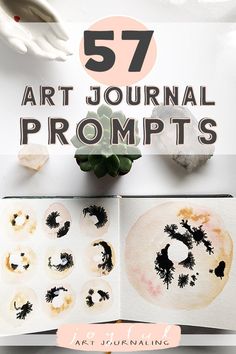 an open book with black ink on it and the title overlay reads 52 art journal prompts