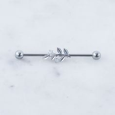 a metal bar with leaves on it