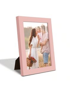 a pink photo frame with an image of a woman holding a baby in her arms