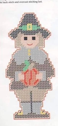 a cross stitch pattern with a boy holding a baseball bat and wearing a green hat