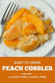 a white plate topped with peach cobbler next to a fork