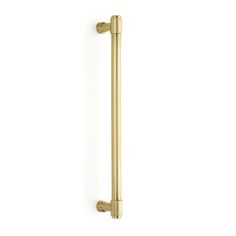 an image of a brass colored handle on a white wall with no one in it