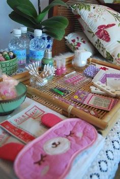 the table is covered with many items for sewing