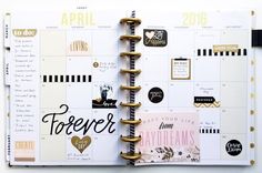 an open planner book with gold foil accents