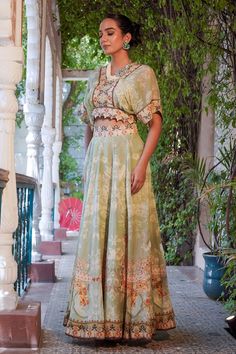 Green lehenga featuring floral, bird and geometric combination mix printed motifs and cut-out waistband. Comes matching printed cape. - Aza Fashions Traditional Drape Palazzo Set With Printed Motifs For Reception, Reception Palazzo Set With Traditional Drape And Printed Motifs, Bohemian Pista Green Sets With Dupatta, Floor-length Georgette Lehenga With Printed Motifs, Pista Green Maxi Length Designer Sets, Floral Embroidered Maxi Sets For Diwali, Bohemian Pista Green Set With Dupatta, Bohemian Maxi Sets With Printed Motifs, Pista Green Maxi Set With Resham Embroidery