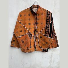 Etsy Pick handmade vintage kantha Boho Jacket, Vintage Kantha Jacket, Vintage kantha Coat, One of kind jacket, Bohemian Style Coat Introducing our exquisite Premium Collection Patchwork Blanket Coats, where every garment embodies a tale of its own. Crafted with meticulous care and unparalleled artistry, each coat is an individual masterpiece, a fusion of history and craftsmanship. At the heart of these extraordinary creations lie vintage kantha fabrics, each carrying its own narrative, woven into the very fabric of time. These fabrics, adorned with vibrant hues and intricate patterns, bear the marks of their journey - a touch of weathered elegance that speaks volumes about their storied past. The imperfections, the occasional wear, and the nuanced markings are not flaws but rather symbols Traditional Multicolor Block Print Outerwear, Traditional Orange Long Sleeve Outerwear, Traditional Long Sleeve Orange Outerwear, Blanket Coats, Style Mantel, Kantha Fabric, Patchwork Blanket, Kantha Jacket, Blanket Coat