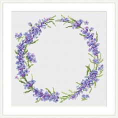 a cross stitch frame with purple flowers on it