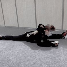 a woman laying on the floor with her cell phone