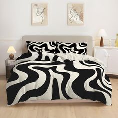 black and white bedding with zebra print on the comforter in a modern bedroom