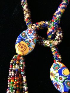 "Stunning lariat necklace from the 1920's with amazing beadwork and colors. In very good vintage vintage condition. Measurements are; From end to end 38 1/2\" Feel free to convo me with any further questions. Thank you for your interest." Vintage Glass Beaded Necklaces With Oval Beads, Vintage Adjustable Beaded Necklace With 108 Beads, Vintage Glass Necklaces With Oval Beads, Vintage Glass Necklace With Oval Beads, Adjustable Vintage Beaded Necklace, Vintage Czech Glass Oval Beaded Necklace, Multicolor Beaded Lariat Necklace With Round Beads, Vintage Multicolor Multi-strand Beads, Vintage Multicolor Beaded Jewelry