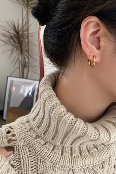 Get ready to double up your style game with the Laine hoops Faux Double Piercing Huggie Earrings! These earrings are the perfect way to add some sass to your look without the need for extra piercings. Crafted from premium 18K gold and super-strong 316L stainless steel, these earrings are as durable as they are chic. The huggie-style hoops are comfy enough to wear all day long, so you can strut your stuff in style. The best part? These earrings are totally sweat and water-resistant, so you can we Trendy Tarnish-resistant Everyday Piercings, Trendy Gold Small Hoop Piercings, Trendy Tarnish Resistant Cartilage Earrings, Trendy Tarnish-resistant Cartilage Earrings, Trendy Gold Piercings With Matching Earrings, Trendy Gold Wrap Earrings For Everyday, Trendy Round Piercings For Everyday, Trendy Hoop Clip-on Earrings, Trendy Hypoallergenic Hoop Cartilage Earrings