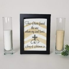 two glasses filled with sand next to a photo frame that says for i have found the one whom my soul loves