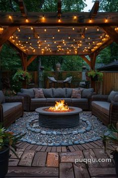 an outdoor fire pit surrounded by patio furniture and string lights in the evening time with wooden pergolated roof