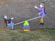 two cartoon figures are on the side of a brick wall and one is pulling another figure