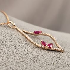 "** Vintage Inspired Ruby & Diamond Pendant** This amazing Ruby pendant is featuring three marquise cut Genuine Rubies (totaling .36cts) and surrounded on all sides by a Sparkling Bright Natural Diamonds (total Diamond weight is .20cts), all set in glowing 14k Rose Gold, hanging from an 18\" 14k Rose Gold chain. This beautiful Pendant has perfectly matching Earrings. **This listing includes the 18\" Loose Rope Chain. **Ruby is the official July Birthstone **Diamond is the official April Birt Fine Jewelry Marquise Pink Gemstone, Marquise Rose Gold Jewelry With Accent Stones, Rose Gold Ruby Jewelry With Diamond Accents, Rose Gold Marquise Jewelry With Accent Stones, Rose Gold Marquise Gemstone Jewelry, Pink Ruby Marquise Jewelry, Pink Marquise Ruby Jewelry, Ruby Diamond Pendant, Diamond Pendants