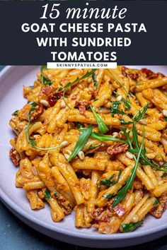 pasta with sundried tomatoes and herbs on a white plate text overlay reads 15 minute goat cheese pasta with sundried tomatoes