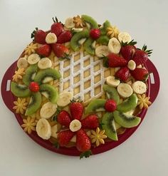 a fruit platter with strawberries, kiwis and bananas