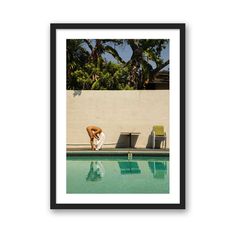 a man leaning on the edge of a swimming pool