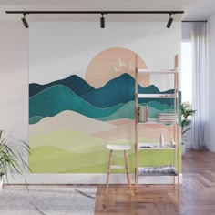 a wall mural with mountains and seagulls painted on it's side in pastel colors