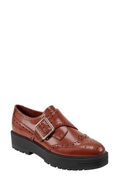 Brogue perforations and wingtip styling add timeless elements to a lofty platform loafer fashioned with an adjustable monk strap for a secure fit. 1 1/2" heel; 1" platform Adjustable monk strap with buckle closure Leather upper/synthetic lining and sole Imported Wingtip Oxfords With Lug Sole, Fall Wingtip Loafers With Brogue Detailing, Leather Platform Wingtip Oxfords, Leather Wingtip Platform Loafers With Brogue Detailing, Leather Wingtip Platform Oxfords, Business Wingtip Platform Loafers With Leather Sole, Pointed Toe Platform Loafers With Brogue Detailing For Work, Platform Loafers With Brogue Detailing For Work, Brown Platform Oxfords For Formal Occasions