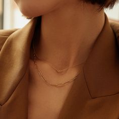 This modern necklace sets the stage for limitless glamour with its unique style. A sparkling round brilliant cut diamond is artistically placed in a paper clip halo pendant that is centered on a shiny rolo link chain. This design is a refreshing take on a timeless look with a contemporary edge that is perfect for day or night. Product Details: Material: 14K Solid Gold Chain Type: Cable Chain 0.9mm thickness Chain Length: 16 inches Extension Chain: 2 inches Pendant Dimension: 5.6mm*3.6mm Stone Ty Modern Diamond Necklace With Delicate Chain, Modern Diamond Necklace With Adjustable Chain, Minimalist Necklace With Paperclip Chain And Round Pendant, Minimalist Paperclip Chain Necklace With Round Pendant, Elegant White Gold Paperclip Chain Necklace, Modern Everyday Luxury Jewelry With Paperclip Chain, Modern White Gold Paperclip Jewelry, Minimalist White Gold Necklace With Paperclip Chain, Minimalist Jewelry With Paperclip Chain And Initial Pendant