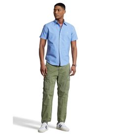 Complete your business casual look with the Polo Ralph Lauren® Garment-Dyed Oxford Shirt..Slim fit shirt has a button-down construction, complete with collar buttons..Shirttail hemline..Signature Pony Player is embroidered on the left chest..100% cotton..Machine wash, tumble dry..Imported..Product measurements were taken using size MD. Please note that measurements may vary by size..Measurements: Length: 30 in Ralph Lauren Casual Shirt For Business Casual, Slim Fit Short Sleeve Shirt With Pockets, Slim Fit Short Sleeve Cotton Button-up Shirt, Slim Fit Cotton Short Sleeve Button-up Shirt, Business Casual Short Sleeve Button-up Shirt With Pockets, Casual Fitted Short Sleeve Shirt With Placket, Fitted Casual Short Sleeve Shirt With Placket, Fitted Casual Shirt For Business Casual, Ralph Lauren Casual Shirt With Button Closure