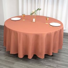 a round table with two place settings on it