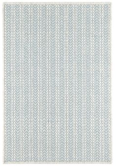 a blue and white rug with lines on it