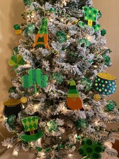 a decorated christmas tree with green and white decorations