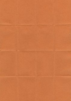 an orange piece of paper that has been folded in to form a rectangle shape